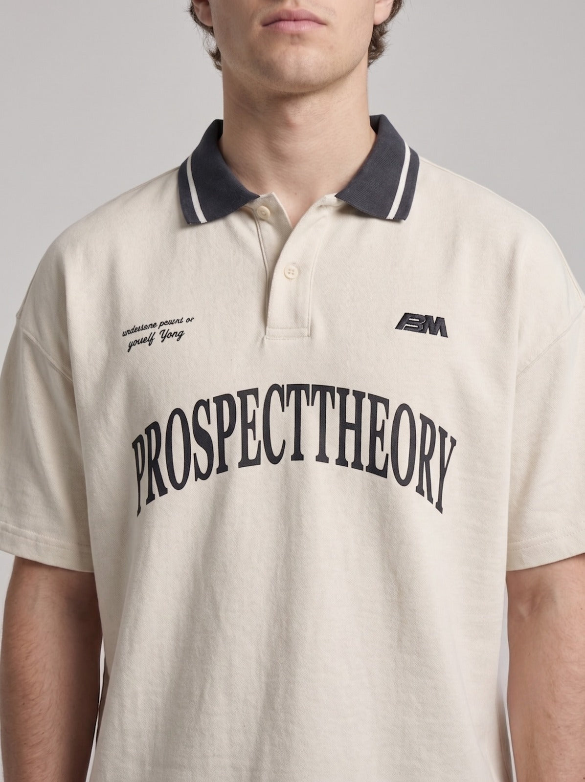 Off-White Retro Varsity Polo with Navy Contrast Collar | Fabric Studio